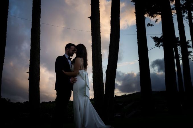 Couple in trees outside